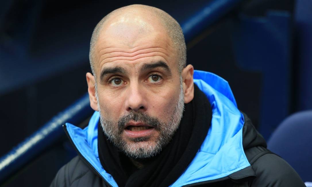 86697933_Manchester-Citys-Spanish-manager-Pep-Guardiola-awaits-kick-off-in-the-English-FA-Cup-fourt.jpg